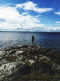Scenic view of sea against cloudy sky