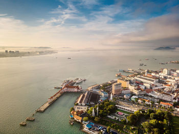 High angle view of city against cloudy sky