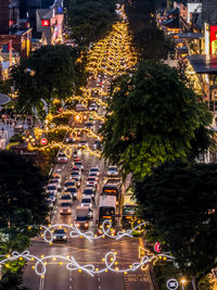 High angle view of illuminated buildings in city at night