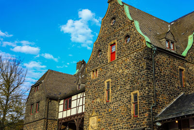 Low angle view of old building against sky