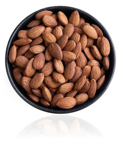 High angle view of coffee beans against white background