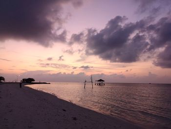 Scenic view of beach against sky during sunset