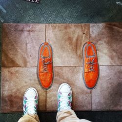 High angle view of person standing on doormat