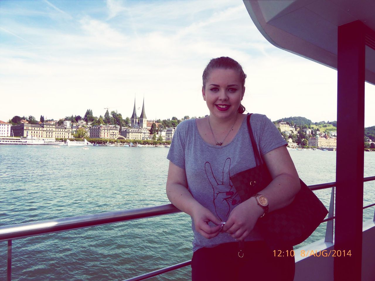 person, water, casual clothing, portrait, looking at camera, young adult, railing, sitting, lifestyles, smiling, sky, front view, leisure activity, waist up, three quarter length, nautical vessel, standing, river