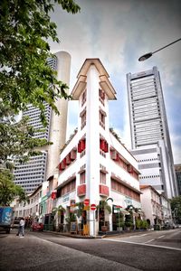 Low angle view of office building against sky