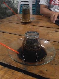 Close-up of drink in glass jar on table