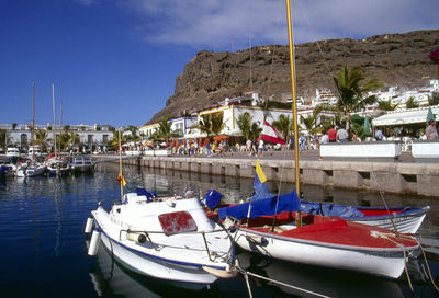 Boats moored at harbor