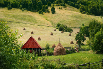 Scenic view of barn and agricultural field in the mountain