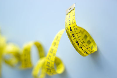 Close-up of tape measure on table