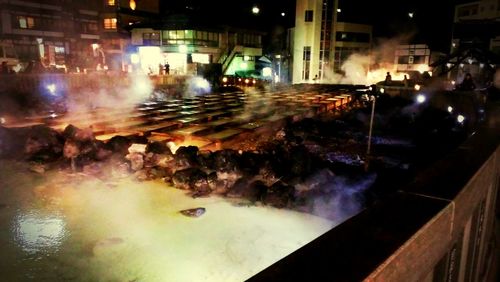 Illuminated fountain at night