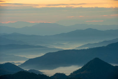 Scenic view of mountains against sky during sunset