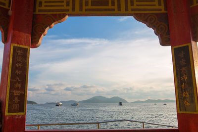 Scenic view of sea against cloudy sky