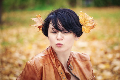 Woman sitting outdoors during autumn