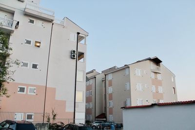 Low angle view of buildings against clear sky