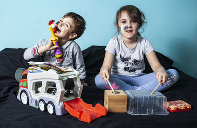Cute girl sitting on toy car
