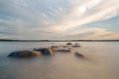 Scenic view of sea against sky during sunset