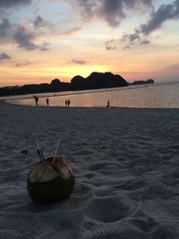 Scenic view of beach against sky during sunset