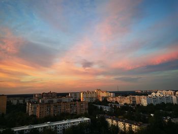 High angle view of buildings against sky during sunset