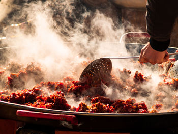 Midsection of person preparing food