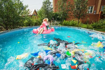 Woman playing in swimming pool