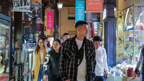 Group of people looking at store