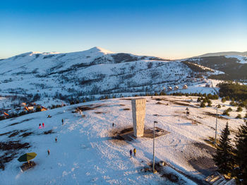 High angle view of snowcapped mountains against sky