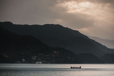 Scenic view of silhouette mountains against sky