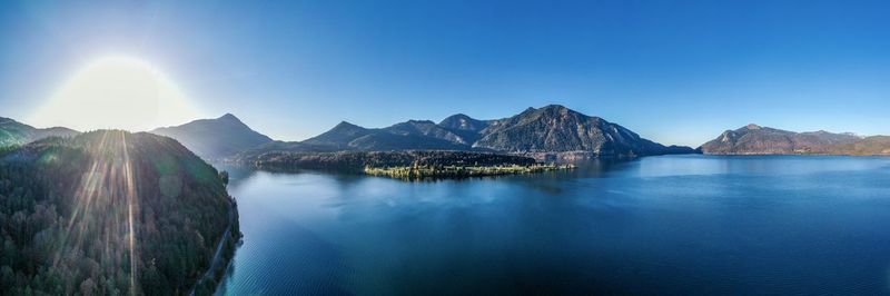 Panoramic view of mountains against blue sky