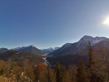 Scenic view of snowcapped mountains against clear sky