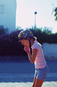 Side view of woman standing outdoors