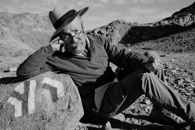 Man sitting on rock