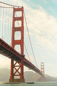 Looking up at the golden gate bridge