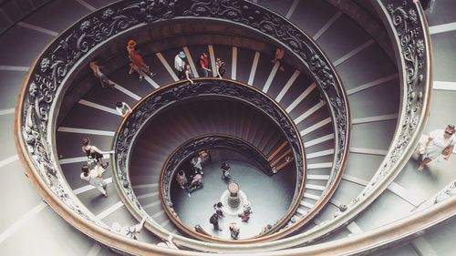 High angle view of people on spiral stairs