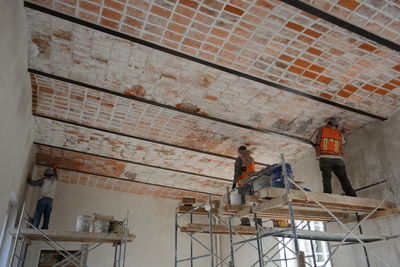 Construction workers working in building