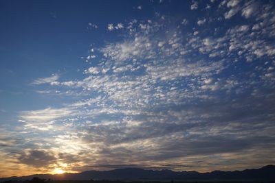 Low angle view of dramatic sky during sunset