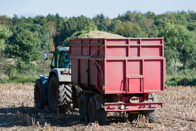 Tractor on field against sky