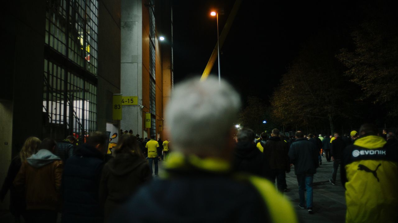 CROWD AT ILLUMINATED CITY