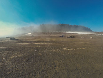 Scenic view of landscape against blue sky