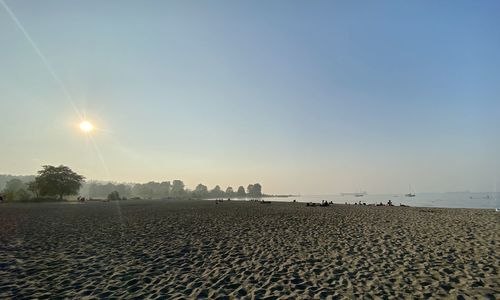 Scenic view of beach against clear sky