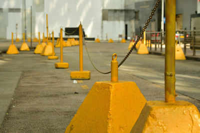 Yellow no-parking block with chains on the street