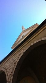 Low angle view of castle against clear blue sky