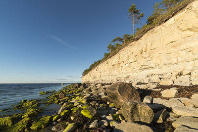 Rocky coastline against sky