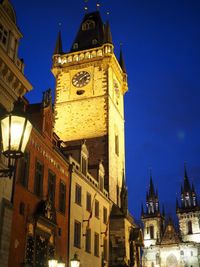 Low angle view of illuminated buildings against sky