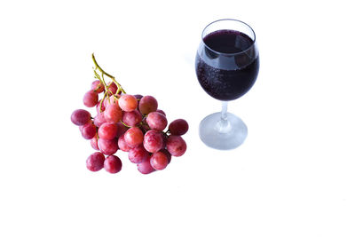 High angle view of grapes against white background