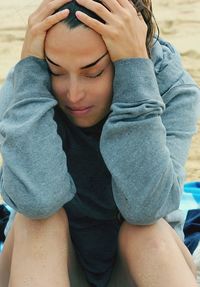 Close-up of boy sitting outdoors