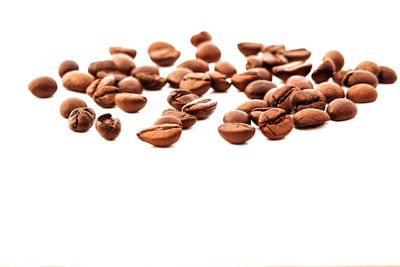 Close-up of fruit over white background