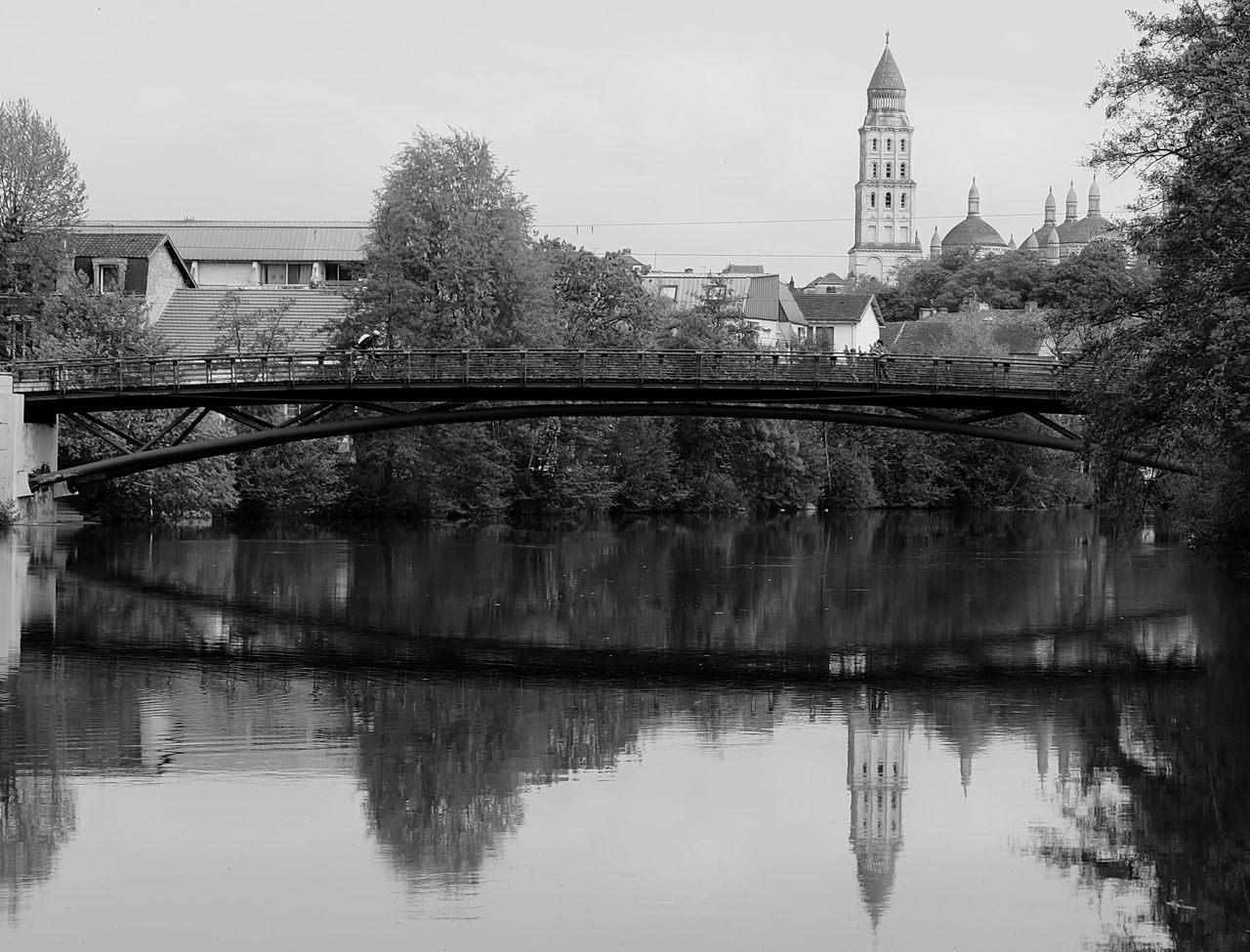 REFLECTION OF BRIDGE AND BUILDINGS IN WATER