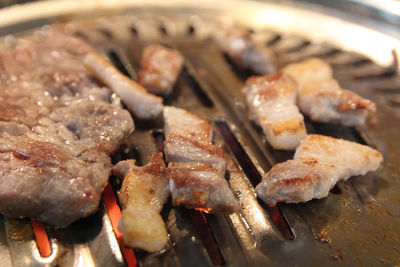 Korean grilled pork bbq or samgyeopsal-gui with charcoal at korean restaurant, busan, south korea