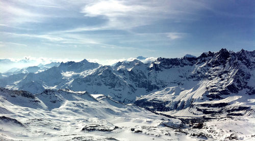 Scenic view of snow covered mountains