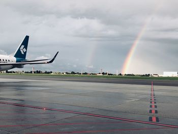 View of airplane at airport runway